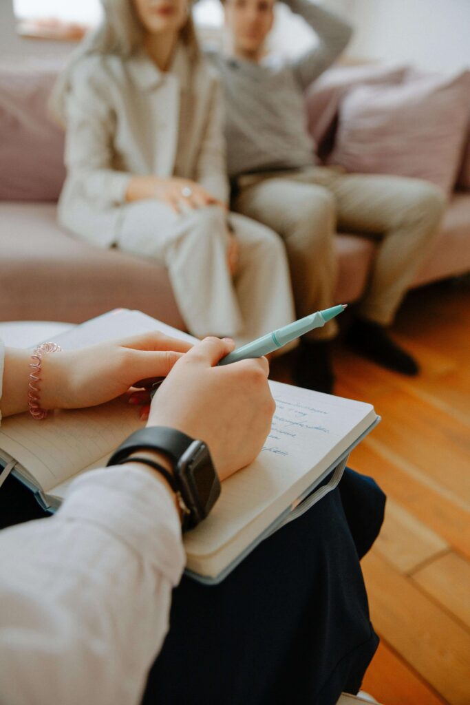 Couples therapist taking notes | eft couples therapy in hermosa beach, ca | multicultural marriage counseling | interracial relationships in south bay, ca | Palos Verdes | Torrance | 90226 | 90254 | South Bay CA 90226 | 90248 A couples therapist writing down notes during a therapy session. Explore the different types of couples therapy in Hermosa Beach, CA, including multicultural couples therapy and intercultural marriage counseling. Find out how EFT therapy can strengthen your relationship.