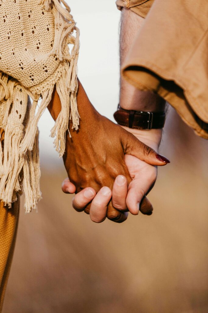 Interracial couple holding hands | multicultural marriage counseling | eft couples therapy in hermosa beach, ca | interracial relationships in south bay, ca | Palos Verdes |Torrance | 90254 | 90226 | 90254 An interracial couple holding hands. Multicultural couple therapy in California can help you and your partner overcome common problems. Grow closer to your partner and achieve better understanding and communication with intercultural couples counseling in Hermosa Beach.