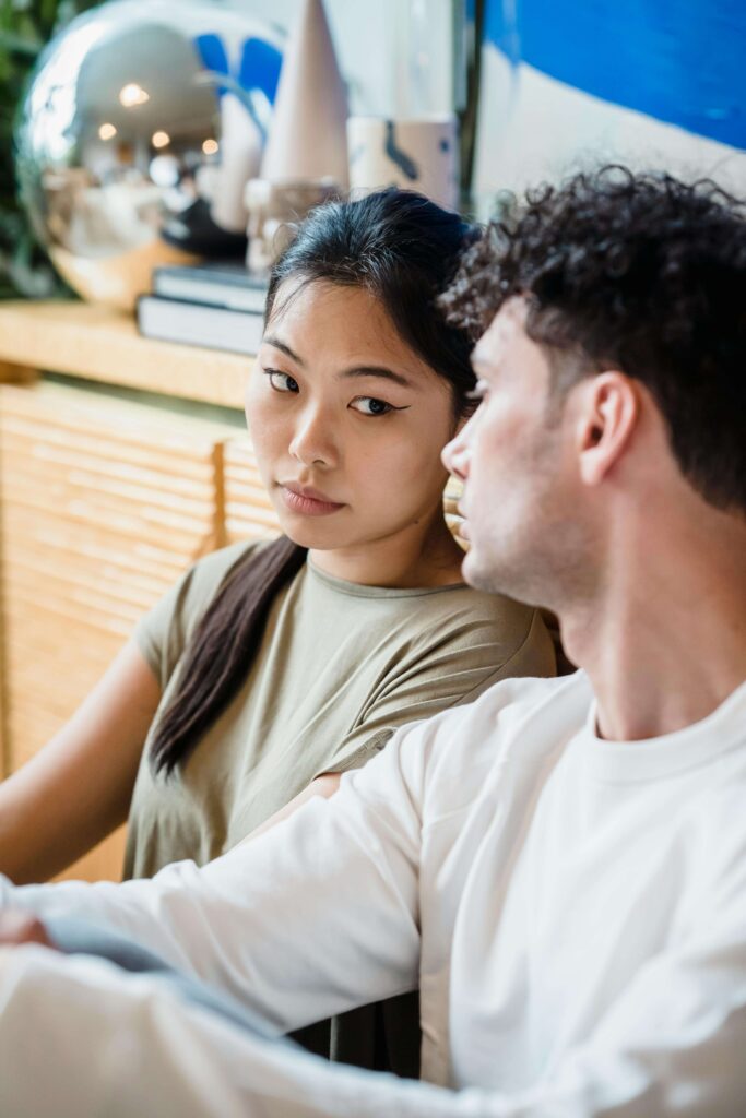 An intercultural couple giving each other a serious look. While cultural differences can strain a relationship, multicultural couples therapy in South Bay, Ca can help. As an experienced intercultural couples therapy therapist, I can teach you how to navigate these differences and strengthen the bond between you and your partner. 